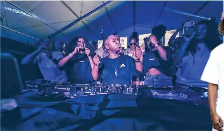  ?? ?? DJ Shimza partying with friends at the People’s Park and Cafe in Durban.