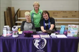  ?? / Kevin Myrick, SJ ?? Cedartown-Polk County Humane Society President Charlotte Harrison stands with volunteers during the annual Rabies Vaccinatio­n clinic in Cedartown on May 5.