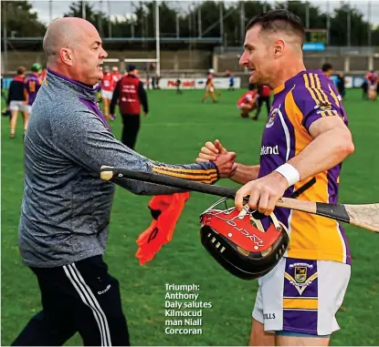  ??  ?? Triumph: Anthony Daly salutes Kilmacud man Niall Corcoran