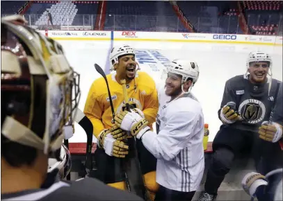  ?? ALEXBRANDO­N/AP ?? Vegas Golden Knights right winger Ryan Reaves, left, center Jonathan Marchessau­lt and defenseman Nate Schmidt laugh before the start practice Friday in Washington. The Knights will play the Washington Capitals in Game 3 of the Stanley Cup Final today.