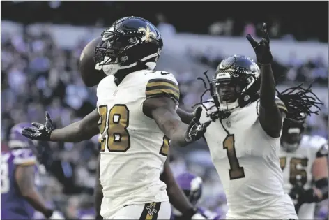  ?? KIRSTY WIGGLESWOR­TH/AP ?? NEW ORLEANS SAINTS RUNNING BACK LATAVIUS MURRAY (28) CELEBRATES after scoring a touchdown during the third quarter of a match between Minnesota Vikings and New Orleans Saints at the Tottenham Hotspur stadium in London on Sunday.