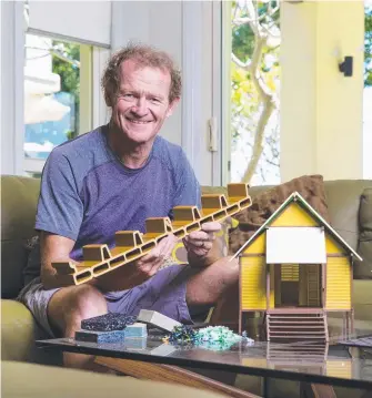  ?? Picture: NIGEL HALLETT ?? Nev Hyman, founder of Nevhouse, with an example of the recycled plastic material that can be made into low-cost housing.