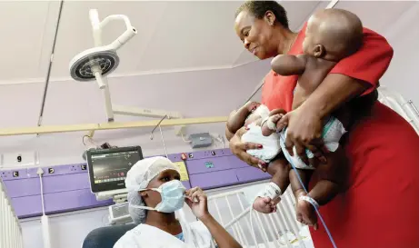  ?? Picture: Oupa Mokoena/ANA ?? DOUBLE JOY: MEC for Health Gwen Ramokgopa with the twins who were separated at George Mukhari Academic Hospital.