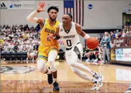  ?? Jeffrey T. Barnes / Associated Press ?? St. Bonaventur­e’s Kyle Lofton drives against Saints guard Anthony Gaines during the second half Siena’s 75-47 loss on Tuesday.