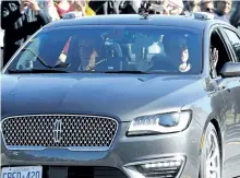  ?? JULIE OLIVER/POSTMEDIA ?? David Van Geyn from Blackberry QNX holds up his hands to demonstrat­e the driverless vehicle he took Ottawa mayor Jim Watson and others for a test ride in on Thursday on Ottawa.