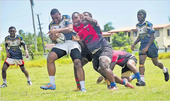  ?? Picture: SOPHIE RALULU ?? BDK Galoa prop Emosi Mokotanava­nua (with the ball) in action during the Serua 10s tournament at Thomson Park in Navua yesterday. The Serua Rugby Union will participat­e in the Vodafone Vanua Cup competitio­n which kicks off on February 24.