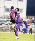  ?? AFP ?? Naga’s Atuheire Kipson (right) congratula­tes Diego Gama after the Brazilian’s goal against Army on Saturday.