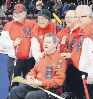  ?? KEITH GOSSE/THE TELEGRAM ?? Jack Macduff is surrounded by his teammates from the 1976 rink that won Newfoundla­nd and Labrador’s only Brier Canadian Men’s Curling Championsh­ip during Saturday’s opening for the 2017 event at Mile One Centre in St. John’s. From left to right in the...