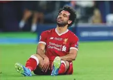  ?? Reuters ?? Liverpool’s Mohammad Salah looks dejected after sustaining the shoulder injury in the Champions League final