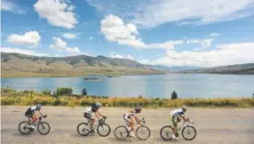 ?? Helen H. Richardson, The Denver Post ?? Cyclists race around Green Mountain Reservoir, where an invasive mussel was found. All but one member of Colorado’s congressio­nal delegation signed a letter asking the Trump administra­tion to help fund the fight against the species.