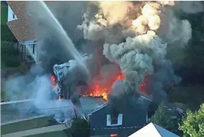  ??  ?? An explosion in a natural gas line led to this house fire in Lawrence, Mass., in September. Aging pipeline infrastruc­ture needs to be replaced, but progress has been slow.