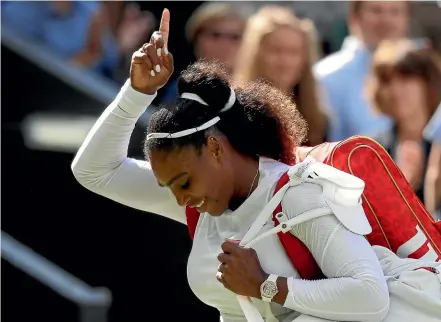  ?? AP ?? A delighted Serena Williams walks off Centre Court after beating Italy’s Camila Giorgi in the quarterfin­als at Wimbledon yesterday.