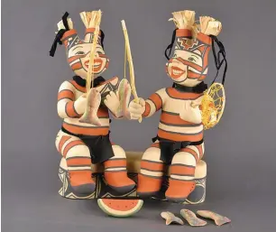  ??  ?? 3. Kathleen Wall (Jemez), ceramic container with lid and two Koshare that serve as handle, polychrome; paint: clay, volcanic ash temper, paint. Courtesy Museum of Indian Arts and Culture. 3