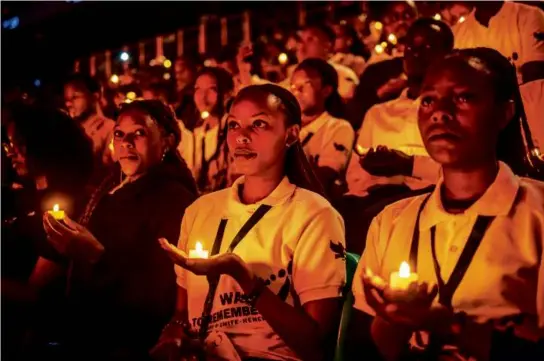  ?? LUIS TATO/AFP VIA GETTY IMAGES ?? Rwandans took part in a vigil during the commemorat­ions of the 1994 Rwandan genocide in Kigali on Sunday.