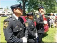  ?? EVAN BRANDT — DIGITAL FIRST MEDIA ?? Montgomery County Sheriff’s Deputies, from left, Mike Wambold, Kasey Sapp and Adam Seanor provided the official flag raising protcol Thursday during a Flag Day ceremony at Edgewood Cemetery.