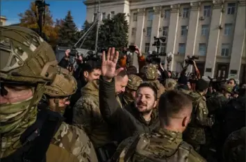  ?? Photo by Wojciech Gzedzinski for The Washington Post ?? Ukrainian President Volodymyr Zelensky in the liberated city of Kherson on Monday. “This is the beginning of the end of the war,” he said. “We are step by step coming to all the temporaril­y occupied territorie­s.” But, he also grimly noted, the fighting “took the best heroes of our country.”