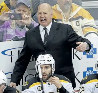  ?? THE ASSOCIATED PRESS FILES ?? Boston Bruins head coach Claude Julien motions to an official during a game against the Pittsburgh Penguins on Jan. 22. On Tuesday, the Bruins fired Julien, who was in his 10th season as head coach, and named assistant Bruce Cassidy interim coach.