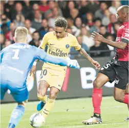 ?? AP ?? Paris St Germain debutant (PSG) Neymar (centre) tries to score past Guingamp goalkeeper Karl-Johan Johnsson (left) during the French League One football match between Guingamp and PSG at the Roudourou Stadium in Guingamp, western France, yesterday.