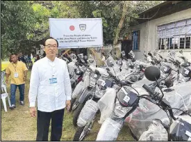  ??  ?? Japanese Ambassador Koji Haneda poses beside 40 motorcycle­s donated by the Japanese government to support Joint Peace and Security Teams in the Bangsamoro Autonomous Region in Muslim Mindanao yesterday.