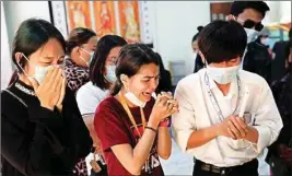  ?? PTI ?? People cry as they view the body of Kyal Sin, also known by her Chinese name Deng Jia Xi, a 20-year-old university student who was shot in the head while she attended an anti-coup protest rally in Mandalay, Myanmar, Wednesday