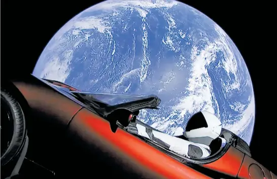  ?? Picture / AP ?? SpaceX’s Starman is now hurtling through space behind the wheel of Elon Musk’s red Tesla sports car.