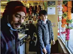  ?? Dan Koeck For The Times ?? “I DON’T THINK most people in America know that Asians exist in places like this,” says Shankar Subba, right, who runs a spice store in Fargo, N.D.