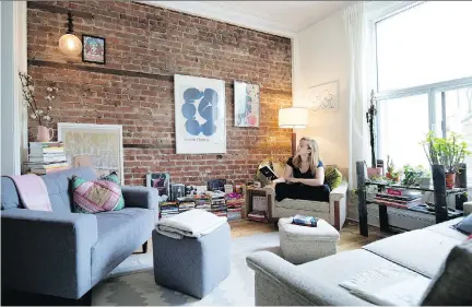  ?? PHOTOS: ALLEN McINNIS ?? A poster of a painting by Hungarian artist Simon Hantaï hangs in Carmen Joy King’s living room, which is furnished with a refurbishe­d, mid-century sofa set. Below left, part of the living room serves as a home office, complete with a repurposed school desk.