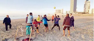  ?? Agence France-presse ?? ↑ Libyan play football on a beach in the capital Tripoli on Monday.