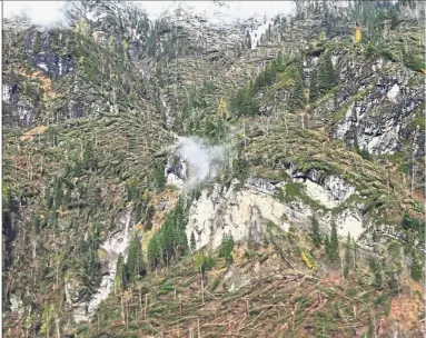  ?? — AFP ?? Rampant devastatio­n: A picture taken by the Italian fire and rescue service showing a destroyed forest in the Dolomites mountain range near the Belluno region in northern Italy.