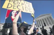  ?? JOSE LUIS MAGANA — THE ASSOCIATED PRESS ?? People protest for and against the confirmati­on of President Donald Trump’s Supreme Court nominee Amy Coney Barrett, rally at the Supreme Court on Capitol Hill, in Washington, Wednesday, Oct. 14.