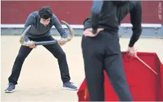  ??  ?? Pupils practice at the Bullfighti­ng School in Las Ventas bullring in Madrid.