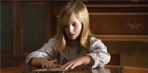  ?? JUSTIN M. LUBIN, UNIVERSAL PICTURES ?? Doris (Lulu Wilson) has no idea what she’s about to unleash in "Ouija: Origin of Evil."