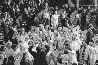  ?? [ERIN SCHAFF/THE NEW YORK TIMES] ?? Women lawmakers wearing white in honor of the women’s suffrage movement pose for a group photograph before the State of the Union address at the Capitol.