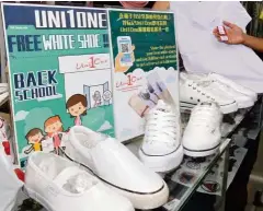  ??  ?? Sitting on the shelf: The free white shoes being offered atthe Uni1One outlet in George Town.
