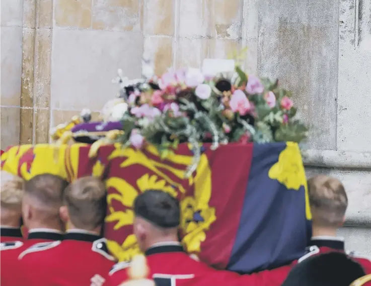  ?? ?? Sovereign’s orb and sceptre, carried into Westminste­r Abbey ahead of the State Funeral .