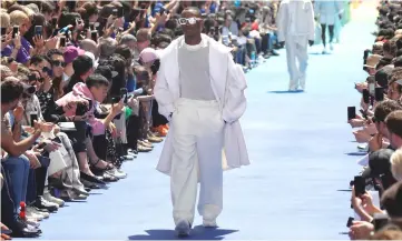  ?? — Reuters photo ?? A model presents a creation by designer Virgil Abloh as part of his Spring/Summer 2019 collection for Louis Vuitton fashion house during Men’s Fashion Week in Paris, France.