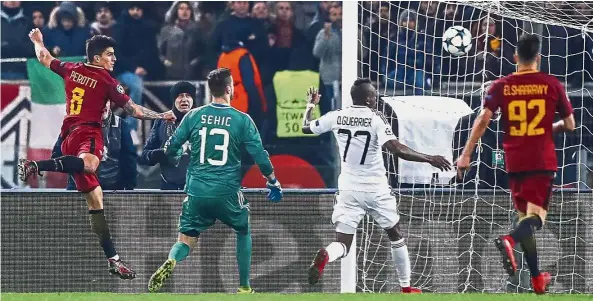  ?? — AP ?? Free header: Diego Perotti (left) scoring AS Roma’s first goal during the Champions League Group C match against Qarabag at the Stadio Olimpico in Rome on Tuesday.