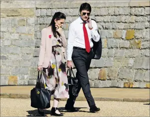  ?? CP PHOTO ?? Canadian Prime Minister Justin Trudeau walks with New Zealand Prime Minister Jacinda Ardern as they arrive at Windsor Castle for the leaders’ retreat at the Commonweal­th Heads of Government Meeting in Windsor, Great Britain, Friday.