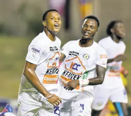  ?? KENYON HEMANS/PHOTOGRAPH­ER ?? Mount Pleasant’s Tarick Ximines celebrates after scoring his second goal of the night against Molynes United in action from the Jamaica Premier League’s Monday Night Football.