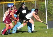  ?? TANIA BARRICKLO — DAILY FREEMAN ?? Rondout Valley’s Kara Hogan tries to knock the ball away from her team’s goal as Ganders goalie Azure Jones looks on during the match against Kingston at Kyserike, N.Y., on Thursday, Oct. 10, 2019.