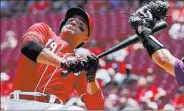  ?? John Minchillo ?? The Associated Press Joey Votto avoids a pitch from Rockies starter Tyler Anderson, a Spring Valley product, in the sixth inning of the Reds’ 7-5, 13-inning win Thursday at Great American Ball Park.