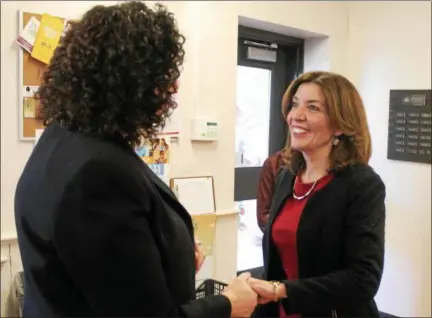  ?? LAUREN HALLIGAN -- LHALLIGAN@DIGITALFIR­STMEDIA.COM ?? New York Lt. Gov. Kathy Hochul, right, greets Capital Roots executive director Amy Klein upon arriving for a tour of the organizati­on’s Urban Grow Center on Monday in Troy.