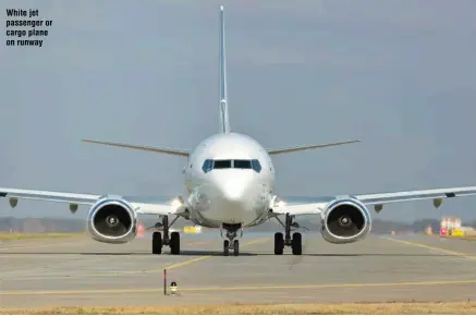  ?? ?? White jet passenger or cargo plane on runway