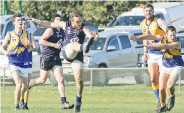  ??  ?? Catani’s Nicholas Visser snaps for goal; Photograph­s: Michael Robinson.