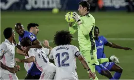  ?? Photograph: Manu Fernández/AP ?? Real Madrid’s Thibaut Courtois catches the ball during his side’s 0-0 draw with Getafe.