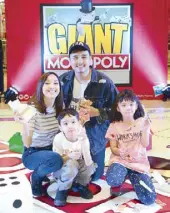  ??  ?? Barbie Almalbis-Honasan with her husband Martin Honasan and their kids Liam and Stina enjoy the life-sized Monopoly board game also at SM Megamall