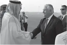  ?? Associated Press ?? Secretary of State Rex Tillerson is greeted on Saturday as he arrives at King Salman Air Base in Riyadh, Saudi Arabia.