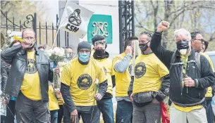  ?? GRAHAM HUGHES THE CANADIAN PRESS ?? Cemetery workers protest the abolishmen­t of 26 seasonal jobs in Montreal. Seasonal workers were far more likely than permanent employees to see hours or jobs lost, writes Heather Scoffield.