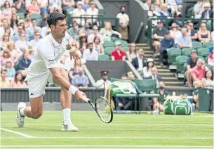  ?? AFP ?? Novak Djokovic returns against Cristian Garin in the fourth round of Wimbledon in London.