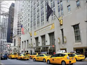  ?? AP/KATHY WILLENS ?? Taxis line up in front of the Waldorf Astoria hotel in New York on Tuesday. It closed Wednesday for two or three years for renovation.